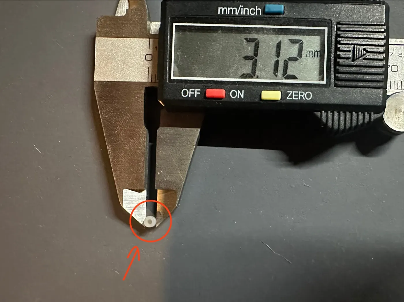 Caliper check of a small silicone gamepad dome feature