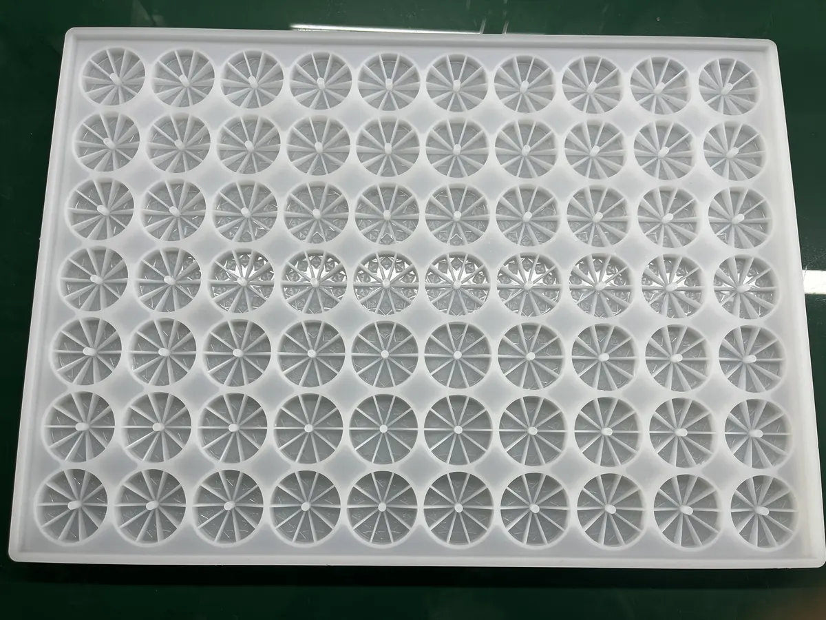 White silicone tray with orange-slice segmented gummy cavities