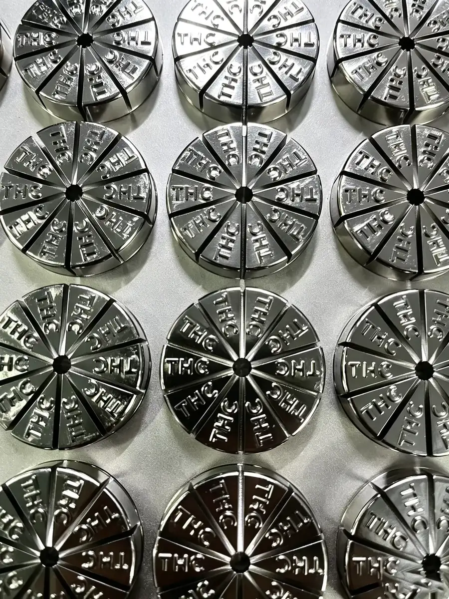 Close-up of steel cavity inserts with customer lettering in each segment