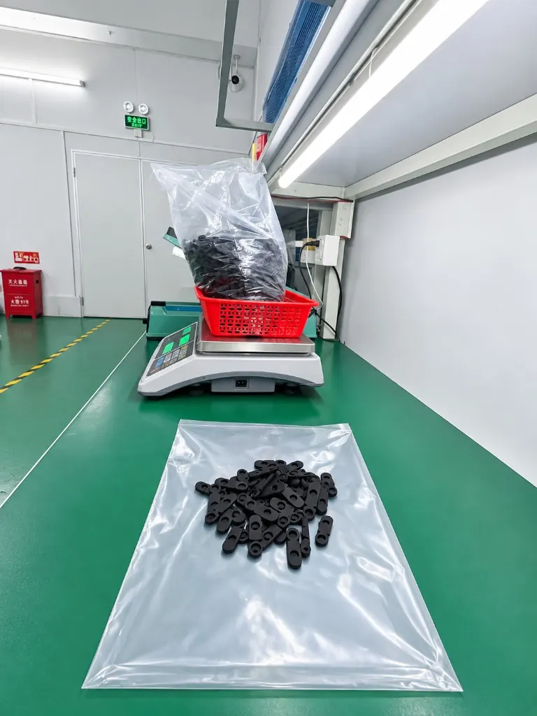 Weigh-check of molded silicone parts at WYD QC